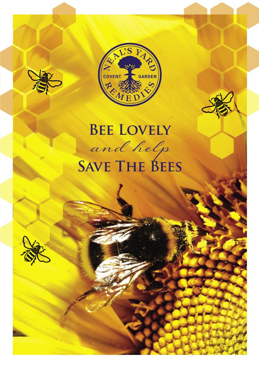 Picture of our 'Save the Bees' campaign poster showing a bumblebee collecting nectar from a bright yellow sunflower - Neal's Yard Remedies