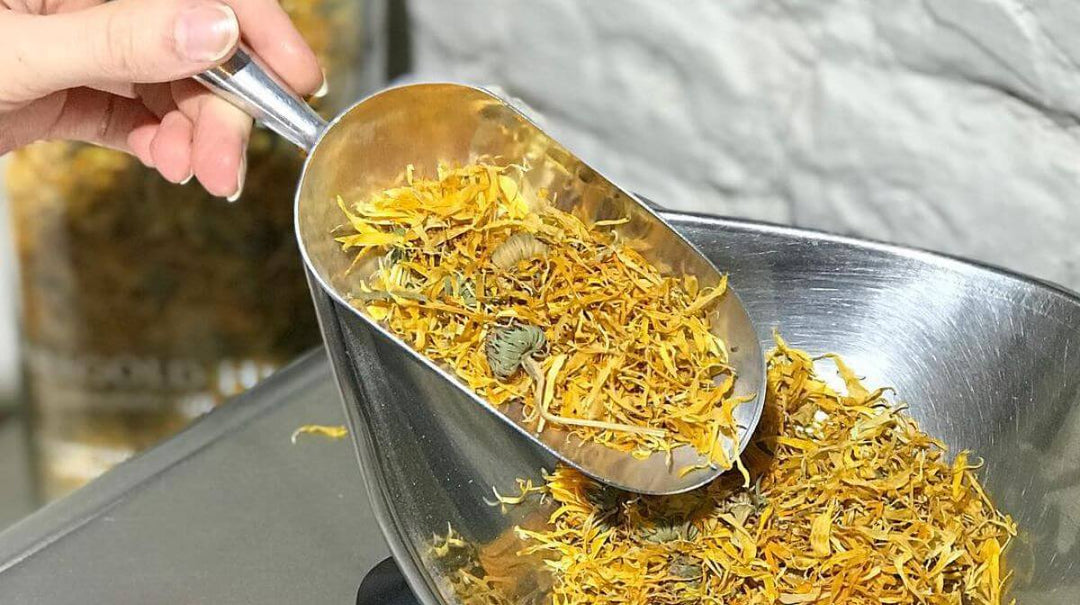 a scoop of dried marigold flowers